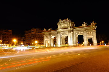 Obraz premium The Puerta de Alcala. Alcala Gate is a Neo-classical monument in the Plaza de la Independencia in Madrid.