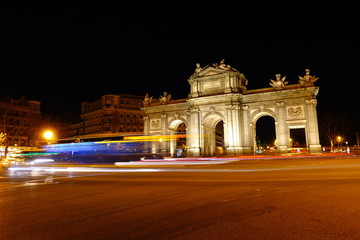 Fototapeta na wymiar The Puerta de Alcala. Alcala Gate is a Neo-classical monument in the Plaza de la Independencia in Madrid.