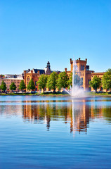 Arsenal with fountain at the Pfaffenteich lake in Schwerin. Mecklenburg-Vorpommern Germany