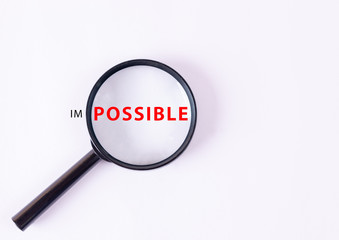 Motivation concept. An enlarged fragment of expression in the lens of a magnifying glass with text 