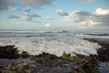 Sea waves broken on seaside rocks