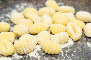 Uncooked fresh homemade gnocchi. Italian cuisine - raw gnocchi, made of potato, flour and egg. 