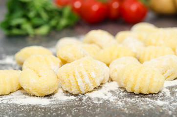 Uncooked fresh homemade gnocchi. Italian cuisine - raw gnocchi, made of potato, flour and egg. 