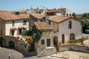 Fototapeta na wymiar Restaurants, houses and narrow streets as viewed from the Roman amphitheatre in Arles, France