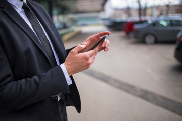 Businessman using smartphone,close up