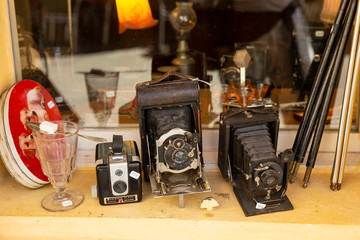 Second hand vintage cameras for sale on a window ledge in Arles, France