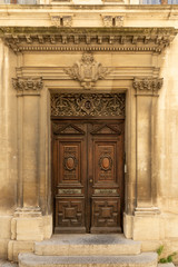 Ornamental wooden doors in Arles, France