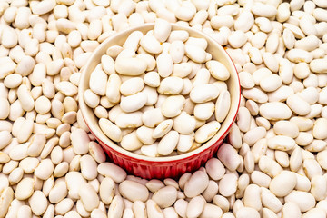 Dry lima beans stone background, in ceramic bowl, top view, wallpaper, close up, macro.