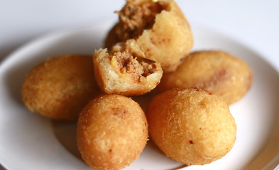 Naklejka na ściany i meble Combro, Indonesian traditional food. Made from cassava is grated and contain oncom sauce. (