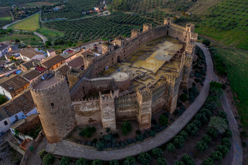 Fototapeta na wymiar Castillo de Bury Al-Hammam in Banos de la Encina La Mancha province Spain old medieval castle with 14 towers from the air