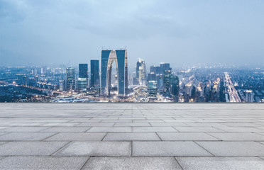 Naklejka premium empty brick floor and cityscape of modern city near , shuzhou,