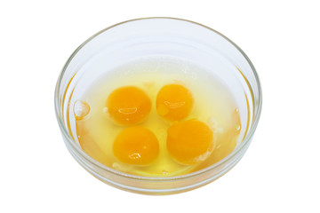 Four egg yolk and white in a bowl isolated on white. four pieces of raw egg in glass jar on white background