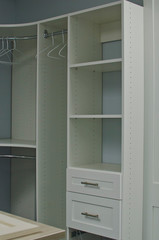 A empty open and new closet organizer in the store showroom. 