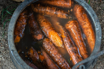 Carrots in a metal bucket filled with water