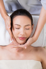 Ayurvedic Head Massage Therapy on facial forehead Master Chakra Point of Asian woman, Therapist Spa body woman hands treatment on customer to increase circulation release tension stress of think work