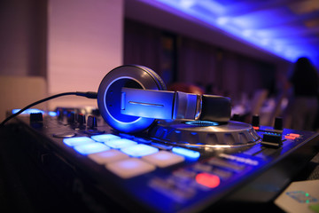 Fototapeta na wymiar Dj mixer with headphones