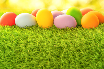 Fototapeta na wymiar Colorful Easter eggs on green grass