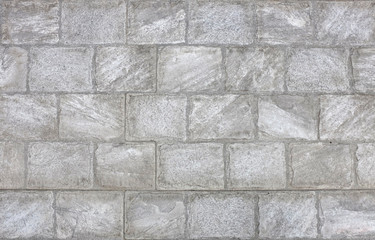 Gray brick wall background.