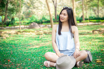 Young woman relaxing in a meadow.