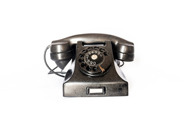 Old antique phone on a white background