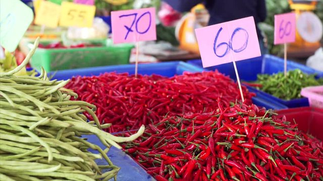 Red peper being sola at a market in Pattaya, Thailan. Assortment of red pepper at a stal at an outdoors market.