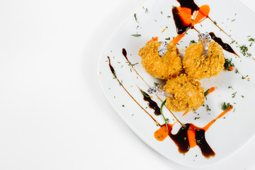 Traditional oriental cuisine of  Vietnam. Tempura chicken legs in breading