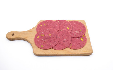  salami on a wooden on background. Slices of salami. Isolated on a white background. cooked boiled ham sausage.