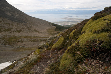 Ushuaia Argentina, view of mountain valley  carved by glacier with city and beagle channel in background