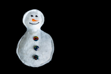 white material hand made snowman with buttons isolated in black