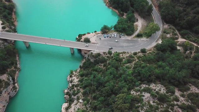 Forward high angle aerial shot of a bridge connecting the end of a gorge in France. Shot in 4K