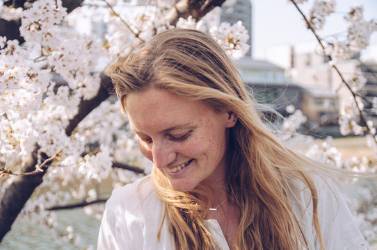 Blonde woman with cherry blossoms