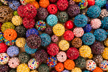 Fototapeta na wymiar Colorful sparkling balls of jewelery beads display.