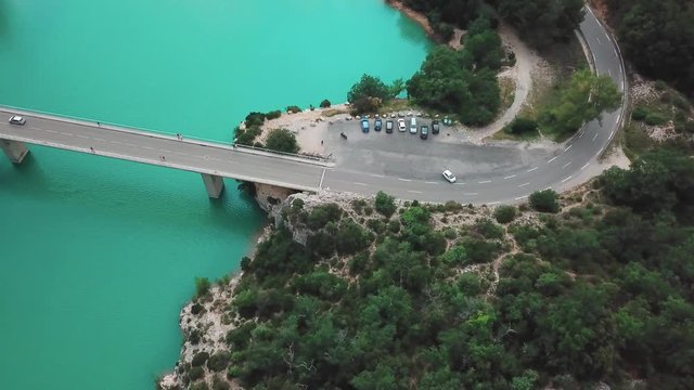 Dolly high angle aerial shot of a bridge connecting the end of a gorge in France. Shot in 4K