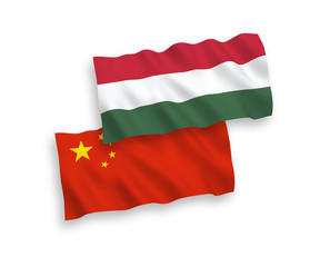 National vector fabric wave flags of Hungary and China isolated on white background 1 to 2 proportion.