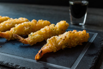 Shrimp Tempura with Soy Sauce on Black  Stone Board.