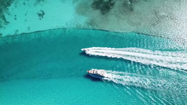 Luxury yacht making its way to the marina in the blue waters of the Caribbean.