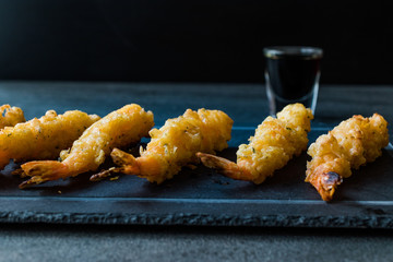 Shrimp Tempura with Soy Sauce on Black  Stone Board.