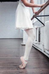 Close up of bent ballet dancers legs