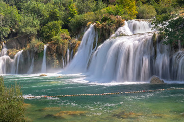 Fototapeta na wymiar Long exposure photo of beautiful big waterfalls at Krka National Park. Croatia