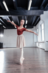 Nice beautiful ballerina standing on pointe shoes