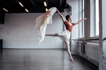 Attractive slim ballet dancer jumping during the dance © Viacheslav Yakobchuk
