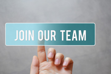 Join our team - hand pressing transparent blue button on virtual touchscreen interface  on grey background with copy space. Concept of invite someone to work together, job or collaboration offer.