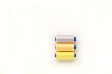 Sewing accessories on a white background. Sewing threads. top view, flatlay