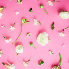 Floral pattern of white ranunculus, snapdragon and tulip flowers on pink background. Flat lay