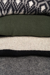 Winter and fall cozy sweaters stack, woolen sweaters