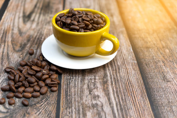 Yellow cup of hot coffee.
