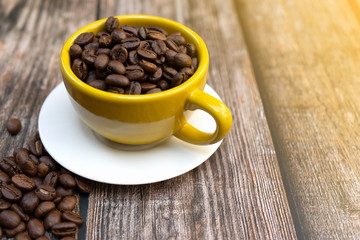 Yellow cup of hot coffee.