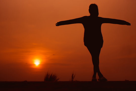 Happy woman on the sunset in nature in summer with open hands - Image