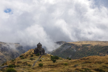 Amberd St. Astvatsatsin (Holy Mother of God) medieval church in slope of Aragats mountain in the clouds. Armenia