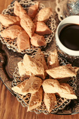 Turkish sweets with coffee on a wooden table